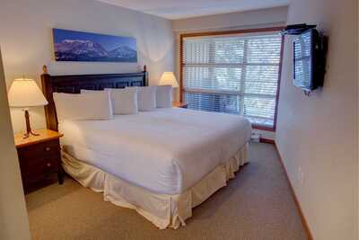 Master bedroom with a king bed