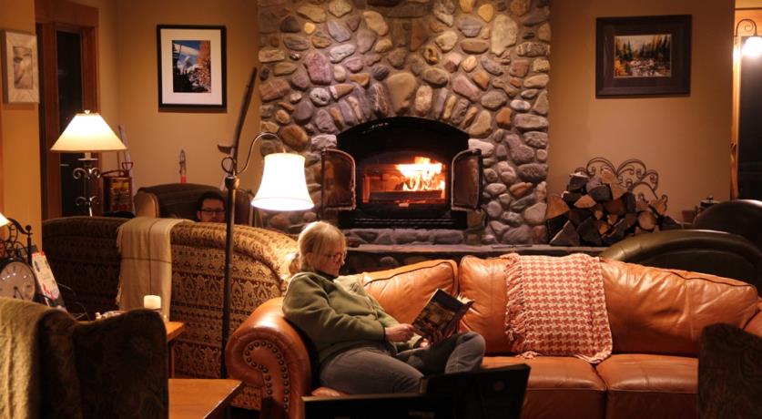 Wood burning fireplace in the large guest area at Vagabond Lodge